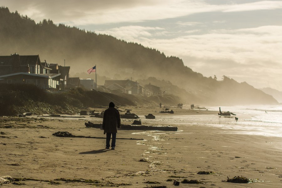 Before: original beach photo with a person walking in frame